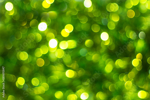 Defocused abstract green background. Blurred holiday bokeh