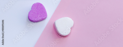 White and pirple candies in shape of heart photo