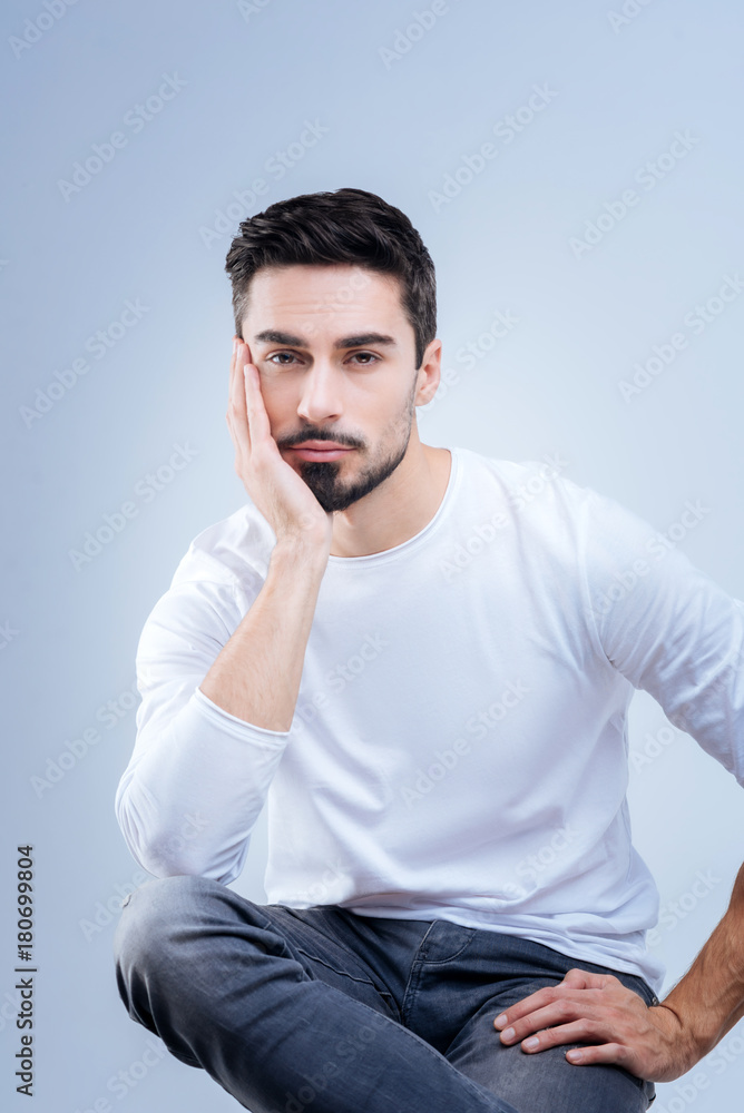 Boring. Sad tired handsome student feeling bored while spending time at the worst lesson in the semester Boring. Sad tired handsome student feeling bored while spending time at the worst lesson in the semester