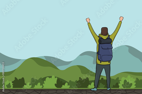 Canvas-taulu A young happy man, back view of backpacker with raised hands in a hilly area