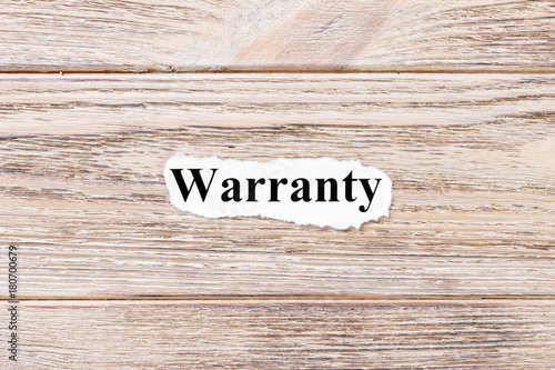 Warranty of the word on paper. concept. Words of Warranty on a wooden background