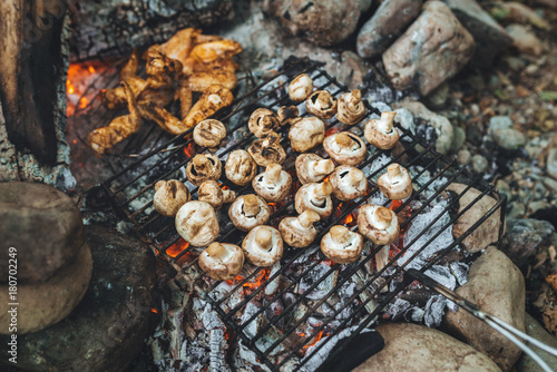 Outdoor BBQ - preparing mushrooms on a grill