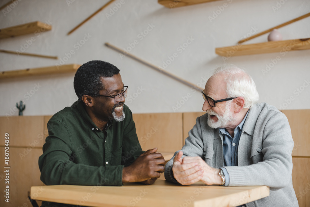 © LIGHTFIELD STUDIOS - senior friends having discussion