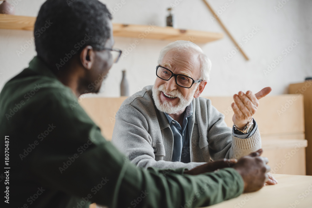 © LIGHTFIELD STUDIOS - senior friends having discussion © LIGHTFIELD STUDIOS - senior friends having discussion