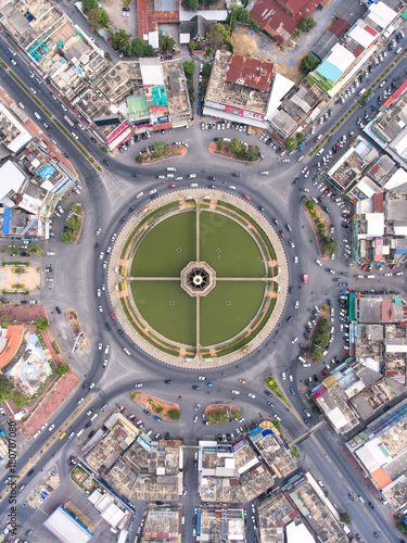 Aerial view Road roundabout, Expressway with car lots in the city in Thailand.beautiful Street , downtown,cityscape,Top view. Background,Aerial view city scape