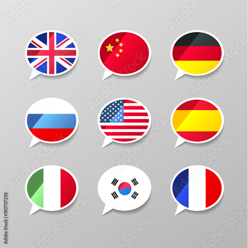 Nine colorful speech bubbles with flags, different language concept