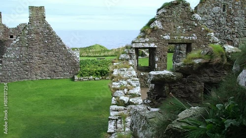 August 2017: Tourists visiting the ruins of Dunnottar Castle on a windy summer day. August 2017 in Dunnottar