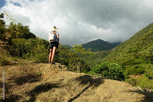 Tourist no the trail for the highest peak on Cuba Pico Turquino being in a mountain range Sierra Maestra on Cuba photo