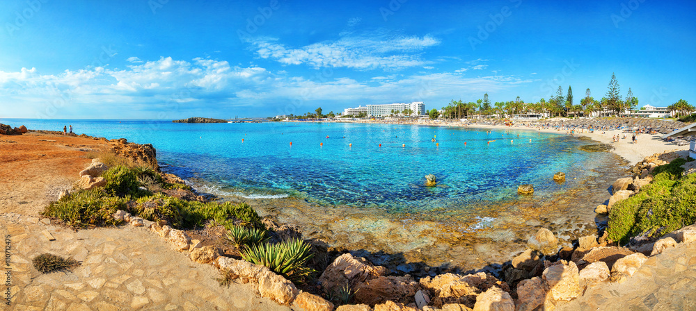 View of turquoise water Nissi beach in Aiya Napa, Cyprus. Ayia Napa coastline. Beautiful sand beach in Aiya Napa, Cyprus. Famous tourist beach in Cyprus