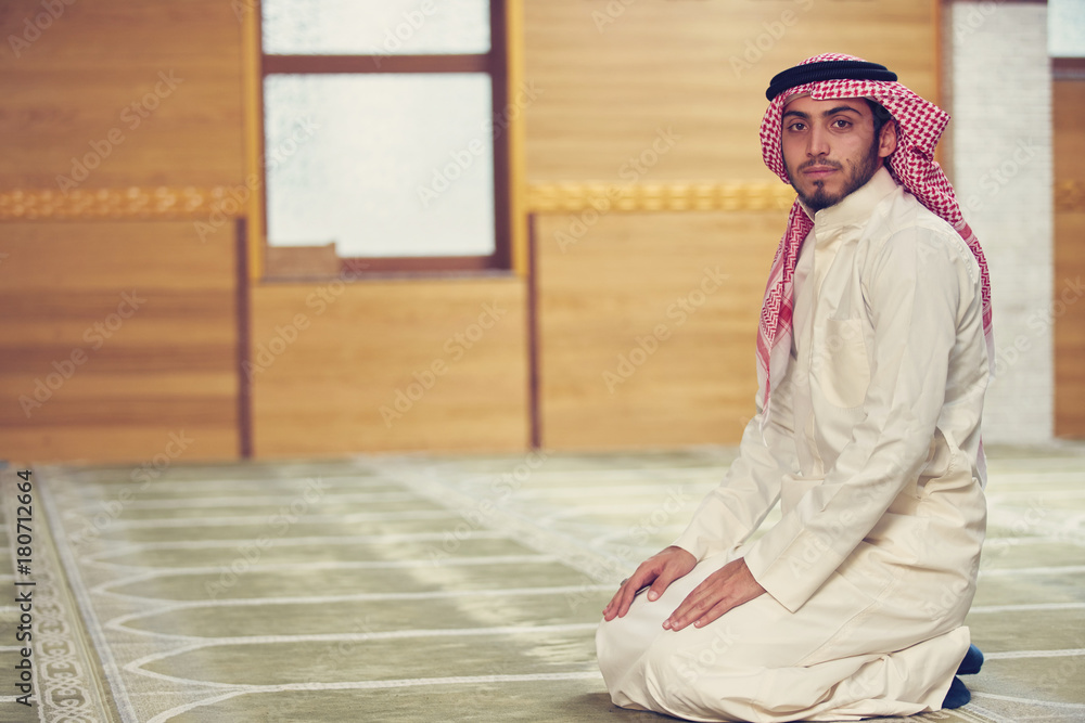 Fototapeta premium muslim man praying inside the mosque