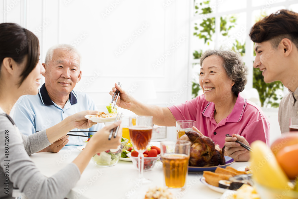 Happy family having dinner together. Happy family having dinner together.
