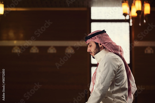 muslim man praying inside the mosque