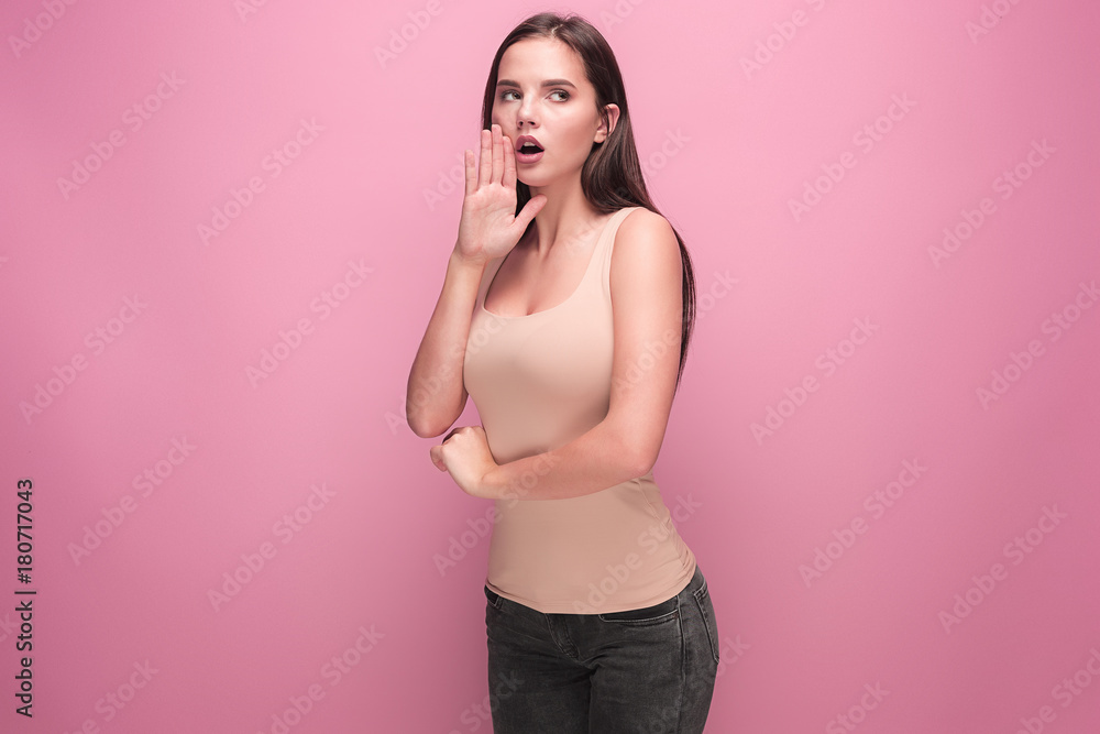Young woman shout and scream using her hands Young woman shout and scream using her hands