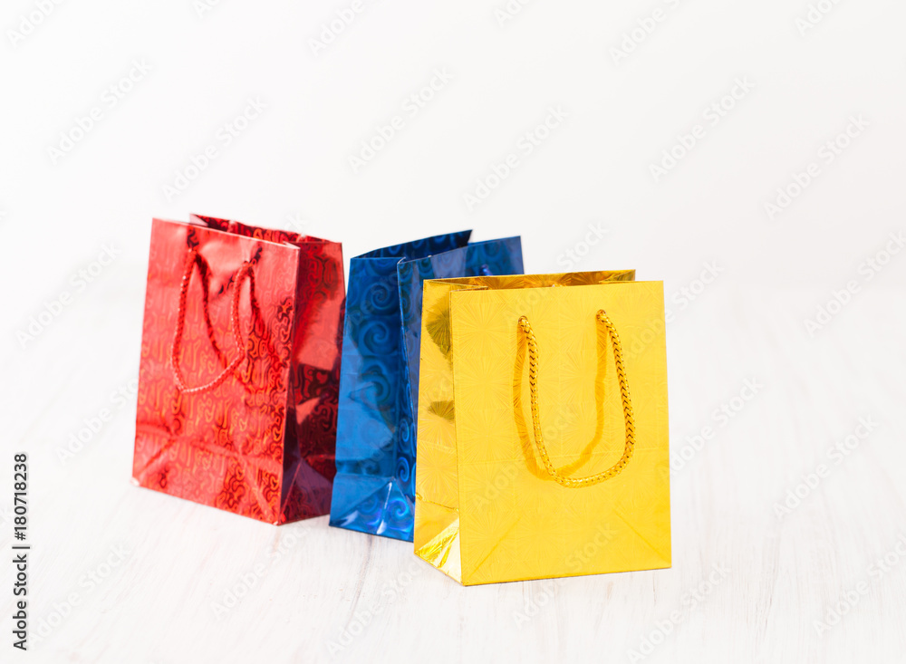 Yellow, red and blue gift bags on white background Yellow, red and blue gift bags on white background