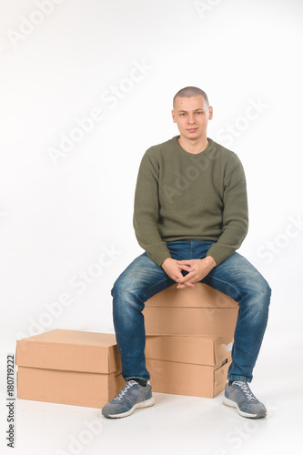 Slika na platnu A young man is skinhead in a green military style sweater