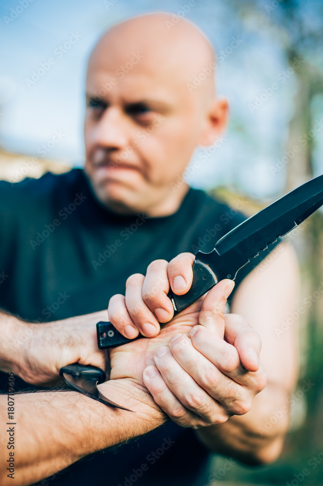 Knife vs knife. Kapap instructor demonstrates fighting and disarming
