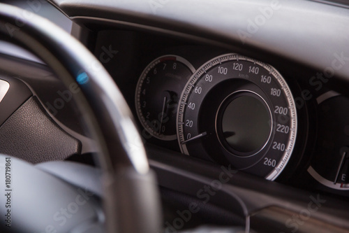 Close-up shot of a speedometer in a Car.
