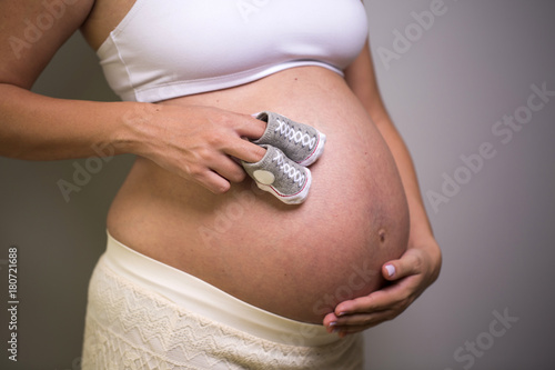 Close up of pregnant belly.