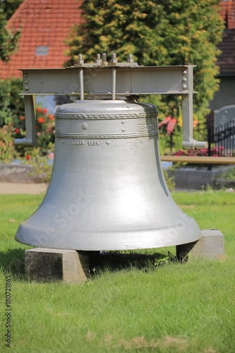 Historic church bell from 1924 on the cemetery of Kroeslin, Germany