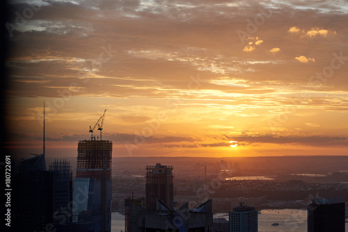 Beautiful city sunset in Manhattan with construction seen from the Top of the Rock.
