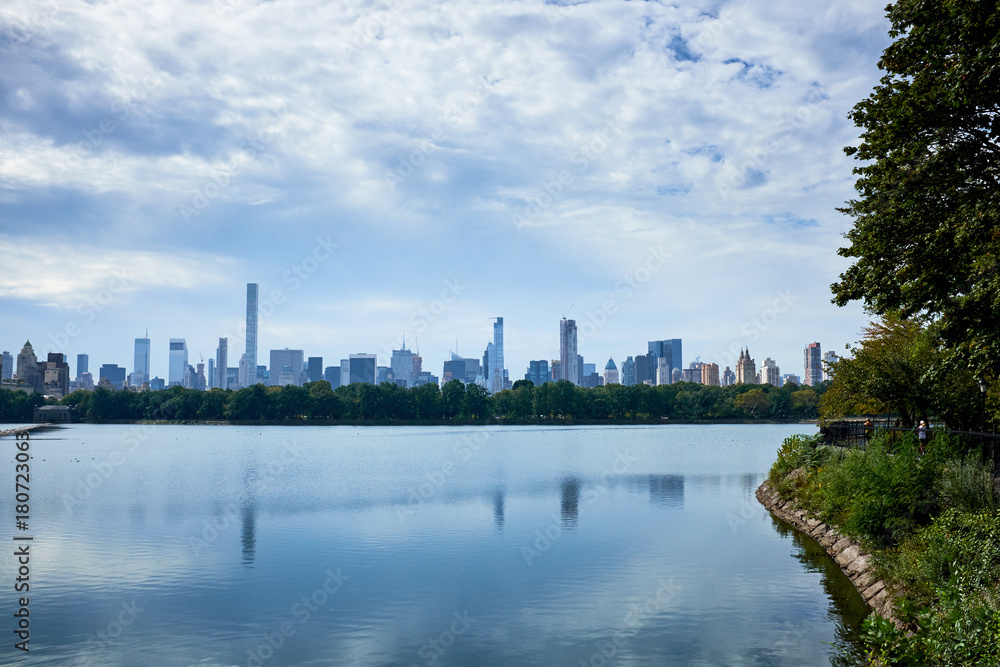 New York skyline and reflection on Jackie Onassis reservoir in Central Park, Manhattan, New York