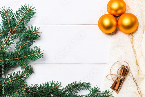 Christmas composition. pine cones, fir branches on wooden white background. Flat lay, top view photo