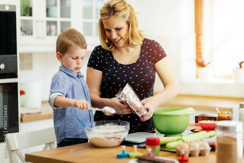 Beautiful child and mother baking Beautiful child and mother baking