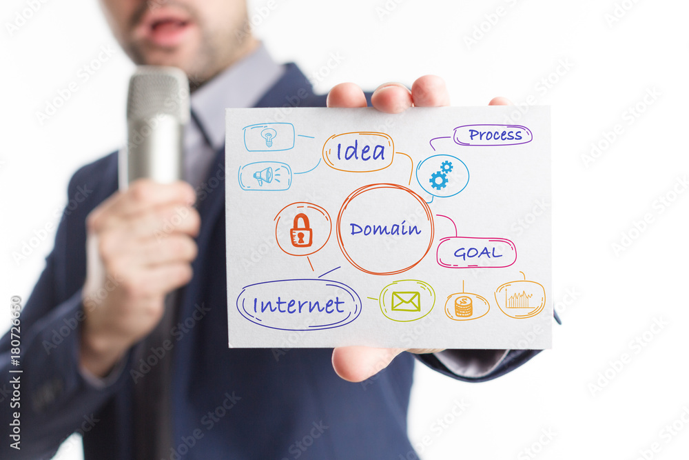 The concept of business, technology, the Internet and the network. Young businessman showing inscription: Domain The concept of business, technology, the Internet and the network. Young businessman showing inscription: Domain