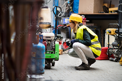 Young female worker in a warehouse.