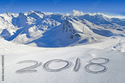2018 written in the snow, mountain landscape in the background
