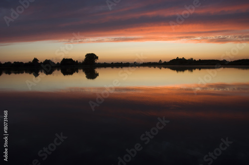 Reflection of colorful clouds after sunset © darekb22