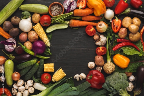 Frame of fresh vegetables on wooden background with copy space