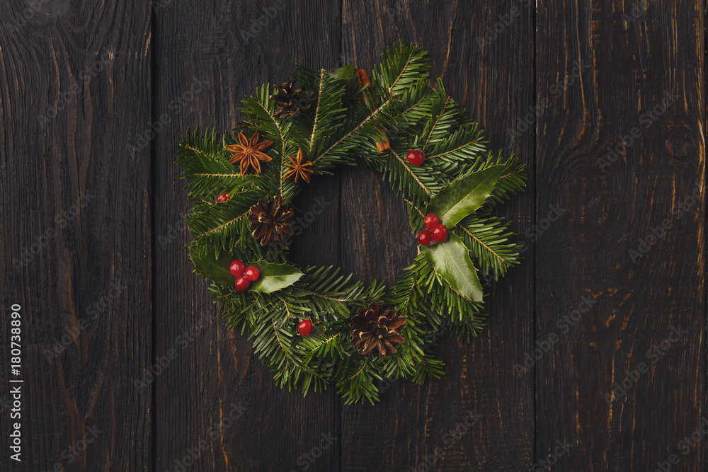 Christmas wreath decoration on rustic wood background. Christmas wreath decoration on rustic wood background.