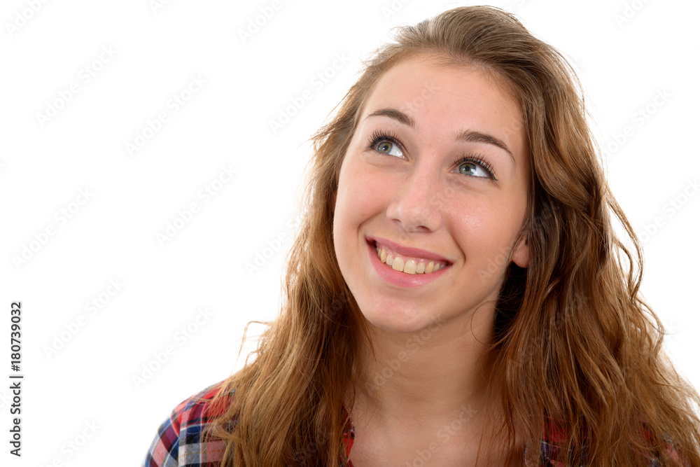 Young beautiful woman thinking looking to the side, on white Young beautiful woman thinking looking to the side, on white