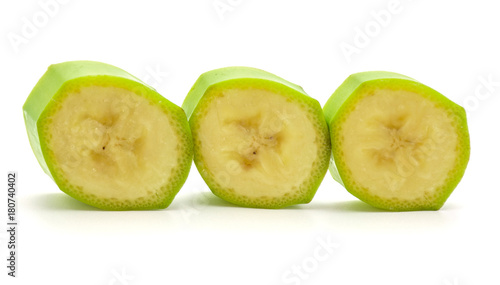 Foto Sliced plantain rings in row isolated on white background.