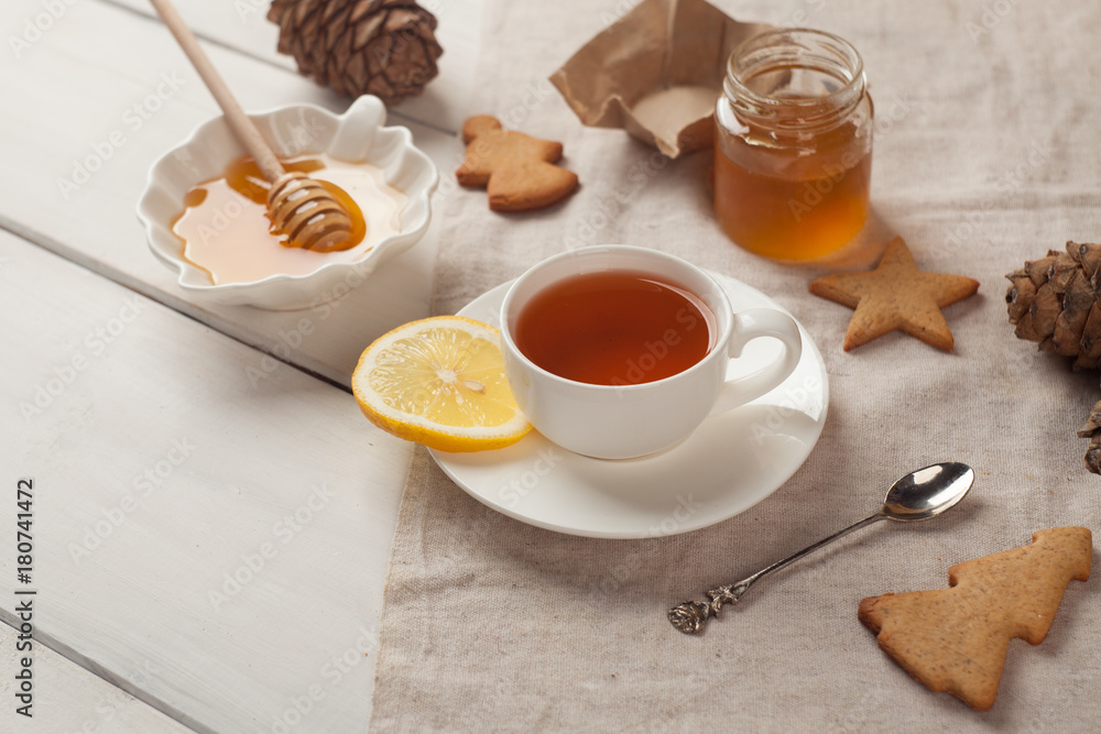 Still life, food and drink, healthcare concept, cup of tea with lemon and honey Still life, food and drink, healthcare concept, cup of tea with lemon and honey