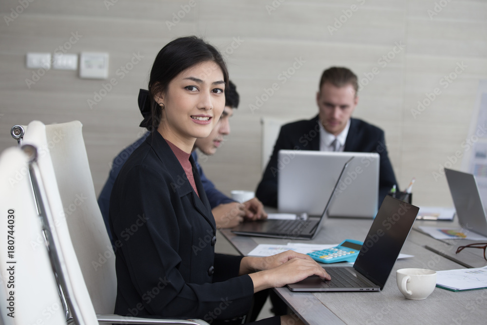 Asian Woman have a meeting with team for Business present. Woman working at meeting room with team. People working concept. 20-30 years old. Asian Woman have a meeting with team for Business present. Woman working at meeting room with team. People working concept. 20-30 years old.