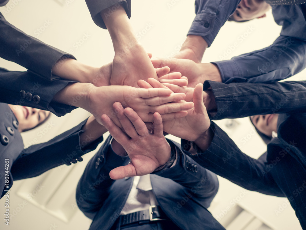 Business people handshaking. People with business team stacking hands together. Vintage tone. Business people handshaking. People with business team stacking hands together. Vintage tone.