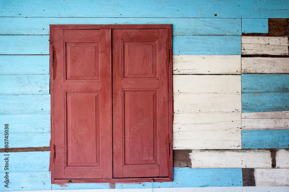Old wood window on wooden wall Old wood window on wooden wall