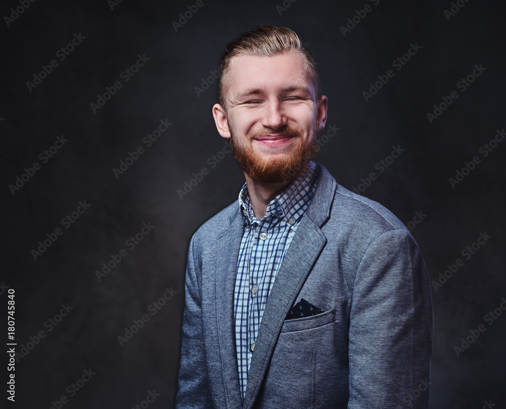 Fototapeta premium A man dressed in a suit over grey background.