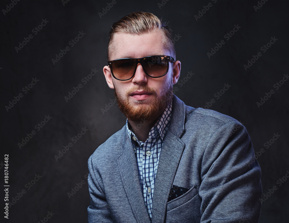 A man dressed in a suit and sunglasses. A man dressed in a suit and sunglasses.