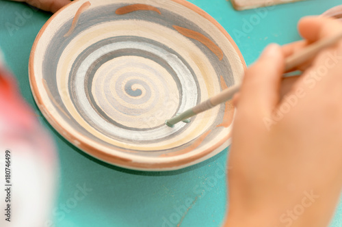 children learn to paint ceramics from the festival in Ukraine