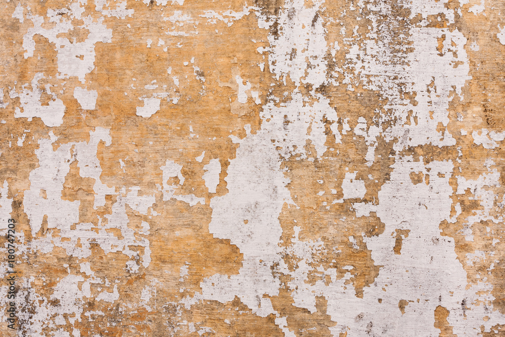 Chipped paint on old wall background - Old cement plastered wall that has chipped paint.