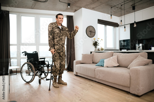 A disabled soldier is leaning on a crutch Fototapeta