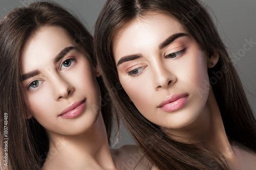 twins women with perfect skin and natural make-up 