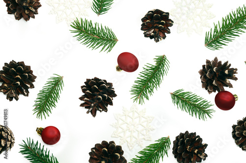 Christmas pattern fir brunches and pine cones on the white background