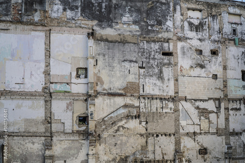 facade of an damaged abandoned apartment wall © berna_namoglu