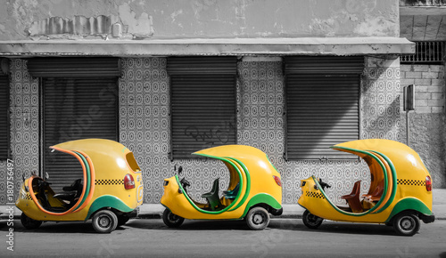 Small cuban coco taxis in line