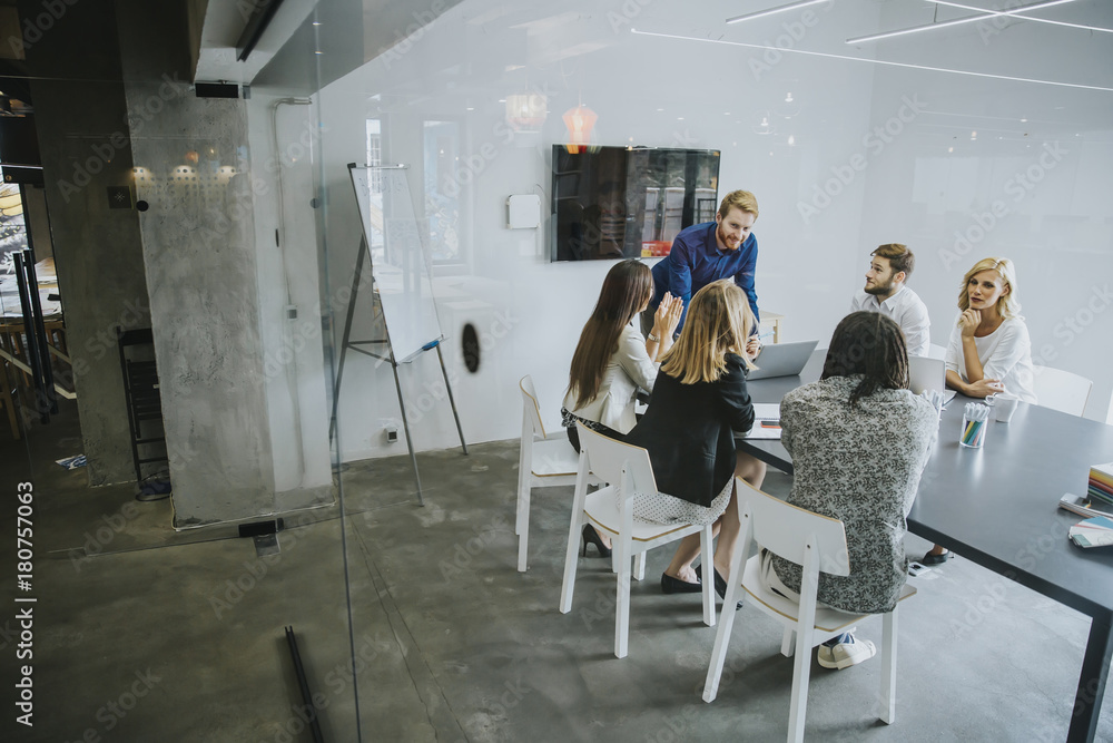 Business people discussing a strategy and working together in office Business people discussing a strategy and working together in office