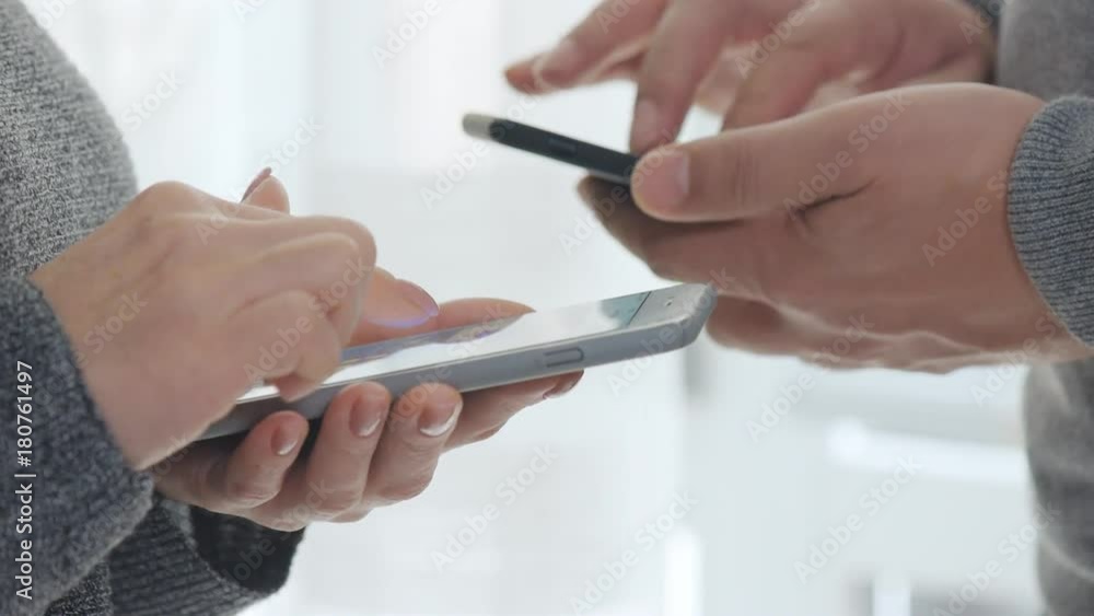 Man and woman using smart phone. Man and woman using smart phone.